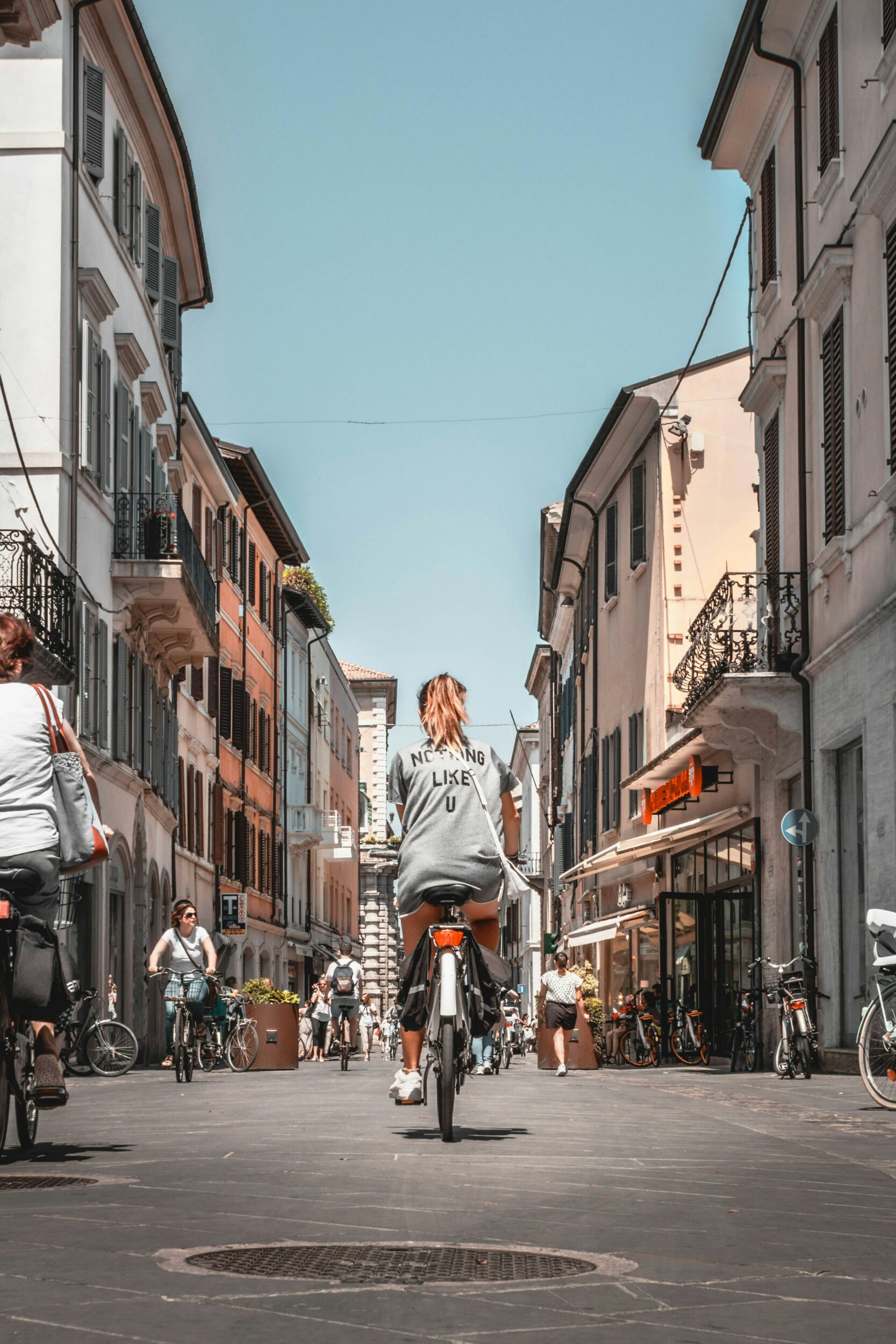 woman riding bike on a city street