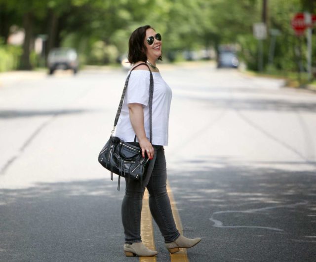 wardrobe oxygen wearing an asos off the shoulder top and rebecca minkoff bag