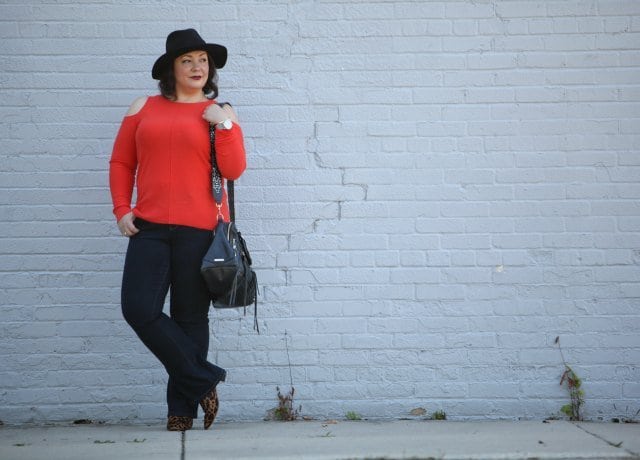 Wardrobe Oxygen, over 40 fashion blogger in JAG Jeans, Nine West leopard calfhair booties, and a Rebeccaa Minkoff moto bag with guitar strap