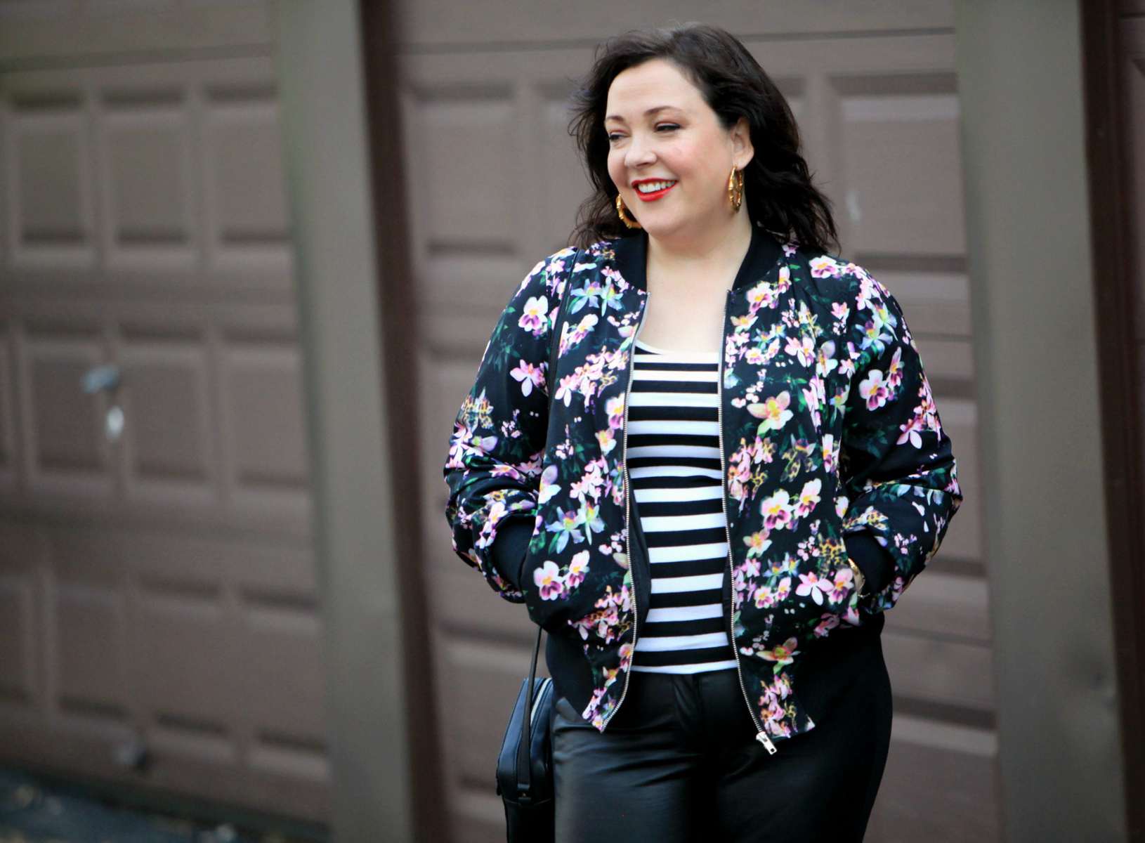 Wardrobe Oxygen, over 40 fashion blogger in floral bomber from Gwynnie Bee and faux leather front ponte pants