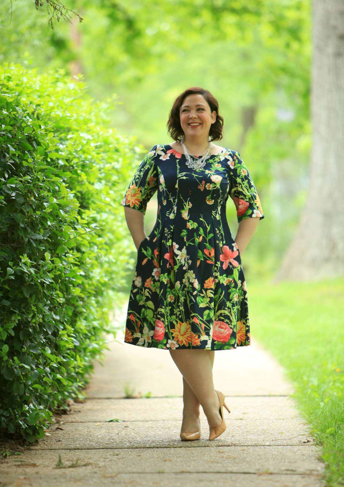 Wardrobe Oxygen in a Gabby Skye floral fit and flare dress via Gwynnie Bee with a Baublebar necklace and Nine West pumps fit and flare dress with sleeves