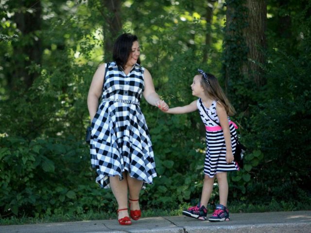 Wardrobe Oxygen in a black and white gingham dress from Gwynnie Bee with a cabi zebra calfhair belt and Naturalizer Adelle red suede platform sandals