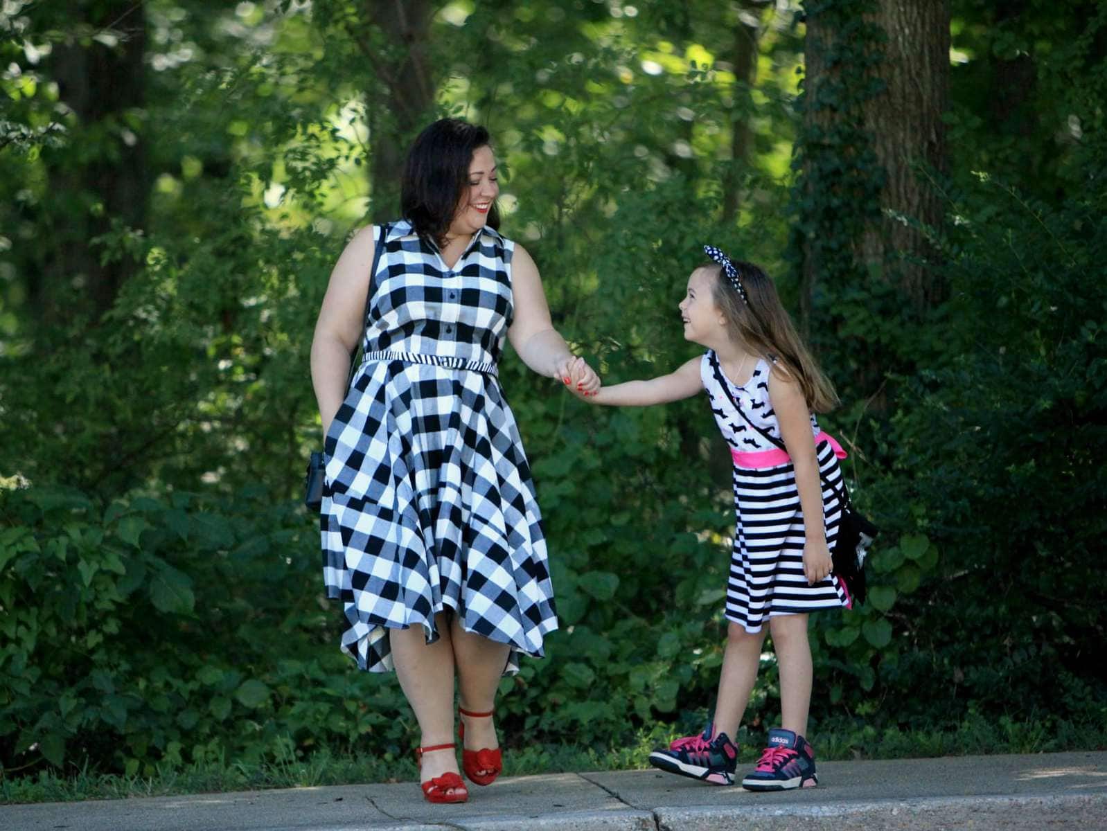 Wardrobe Oxygen in a black and white gingham dress from Gwynnie Bee with a cabi zebra calfhair belt and Naturalizer Adelle red suede platform sandals