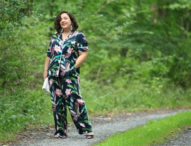 Wardrobe Oxygen in daytime pajamas in a navy botanical print by ELOQUII styled with J. Crew earrings and a Loeffler Randall fringe clutch