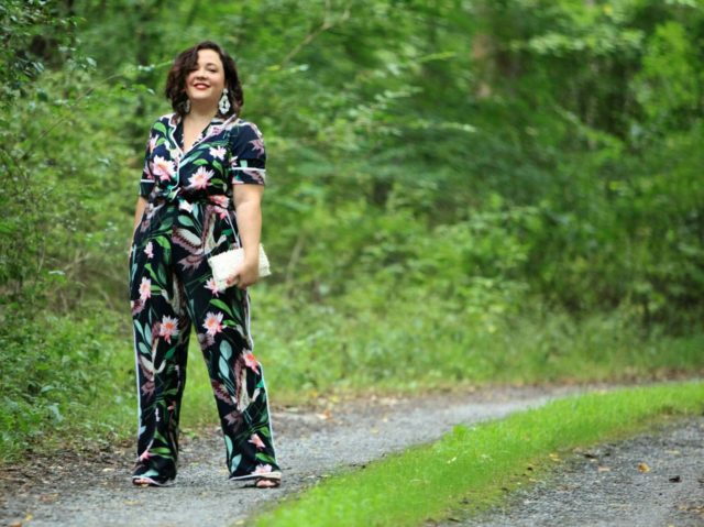 Wardrobe Oxygen in daytime pajamas in a navy botanical print by ELOQUII styled with J. Crew earrings and a Loeffler Randall fringe clutch