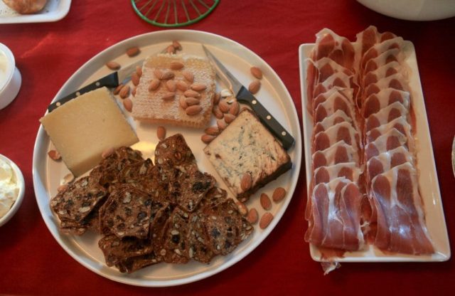 display of brunch food on a red tablecloth