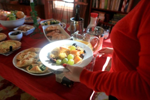 display of brunch food on a red tablecloth