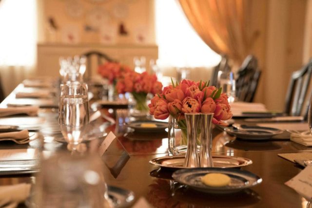 A view of the dining table in the Good Housekeeping Dining Room, set for a meal