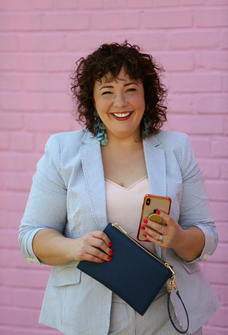 Wardrobe Oxygen in a seersucker pantsuit with blush J. Crew camisole, nude pumps from Nine West, and the Dagne Dover Essentials Clutch Wallet