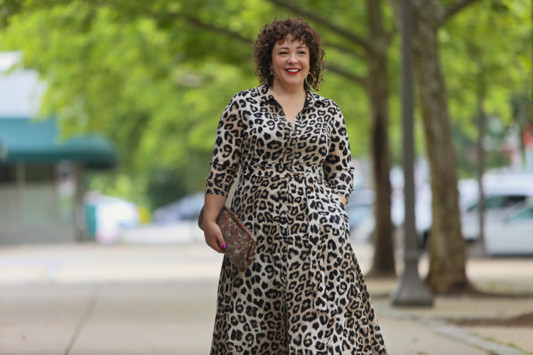 image of Alison wearing a leopard print maxi dress and aviator sunglasses