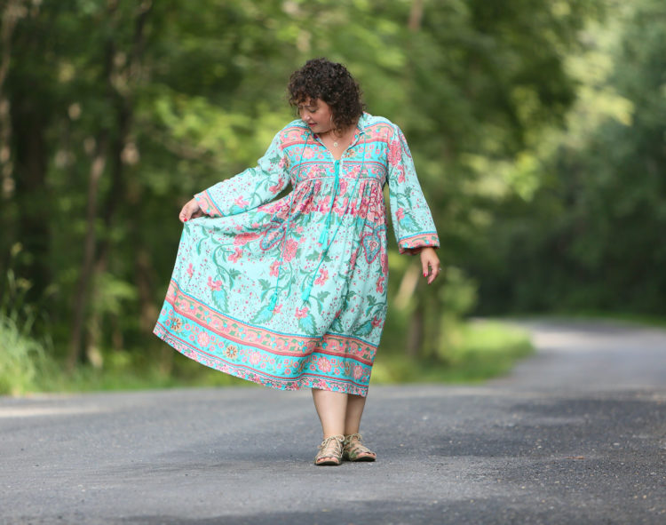 woman in floral midi length dress