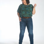 Wardrobe Oxygen in the cabi Paradox Top tucked into the Tuxedo High Straight jeans with the Beast Belt at the waist.