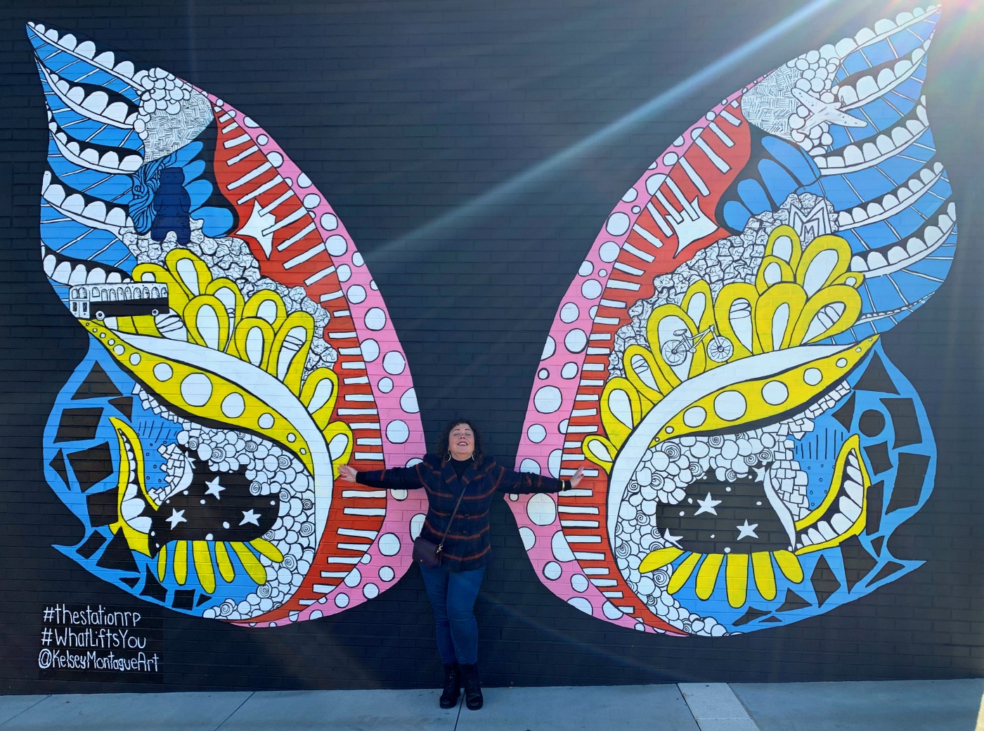 Wing mural in Riverdale Park, Maryland by muralist Kelsey Montague