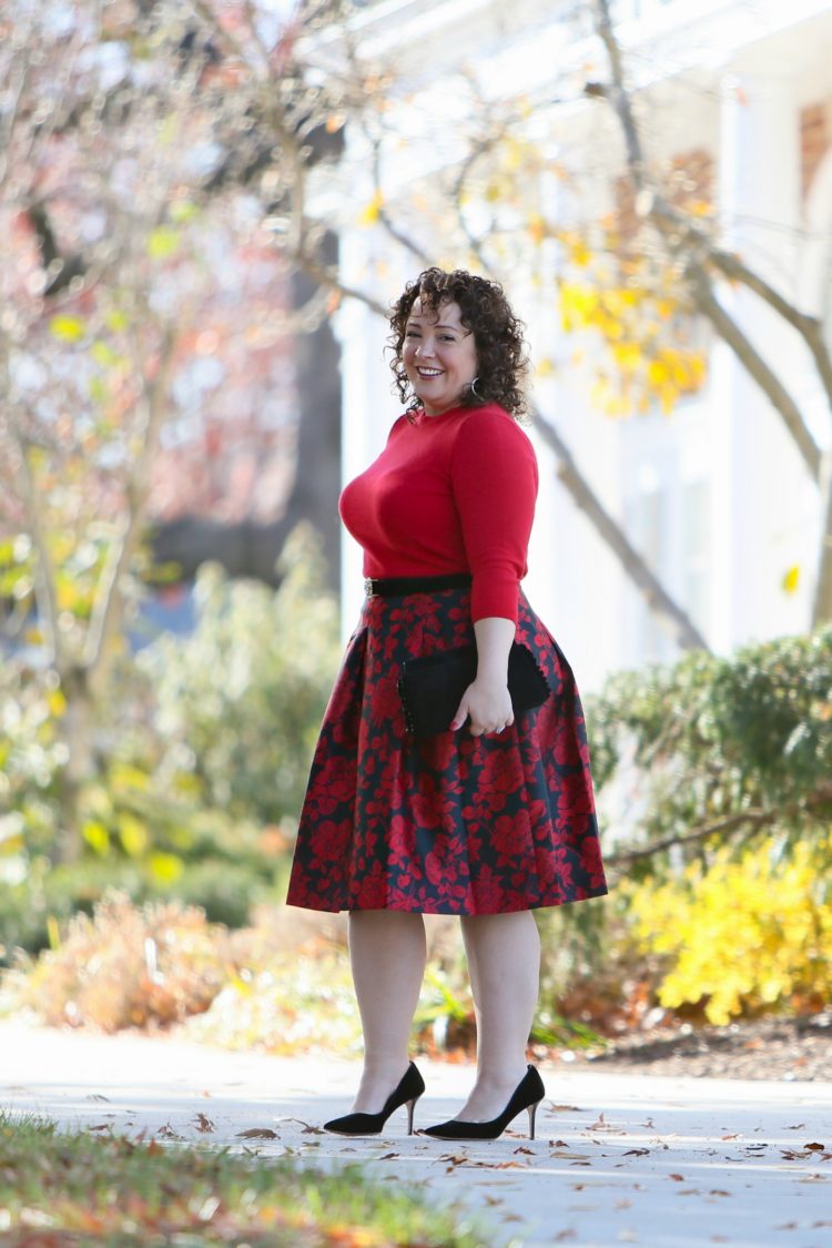 Alison Gary of Wardrobe Oxygen in a red sweater and jacquard skirt, with an uplifted smooth bust thanks to the Fantasie smoothing t-shirt bra.