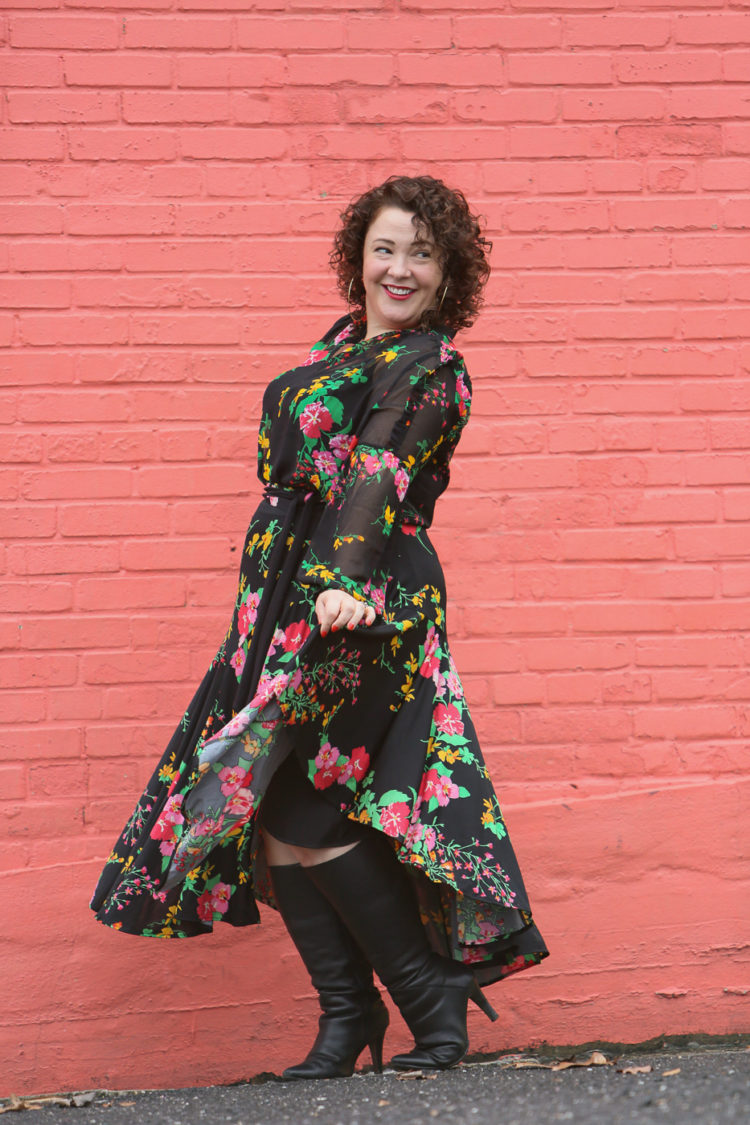 Alison Gary of Wardrobe Oxygen in a black floral blouse and wrap skirt from cabi