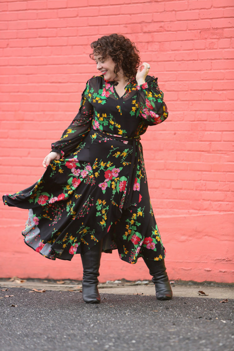 Alison Gary of Wardrobe Oxygen in a black floral blouse and wrap skirt from cabi