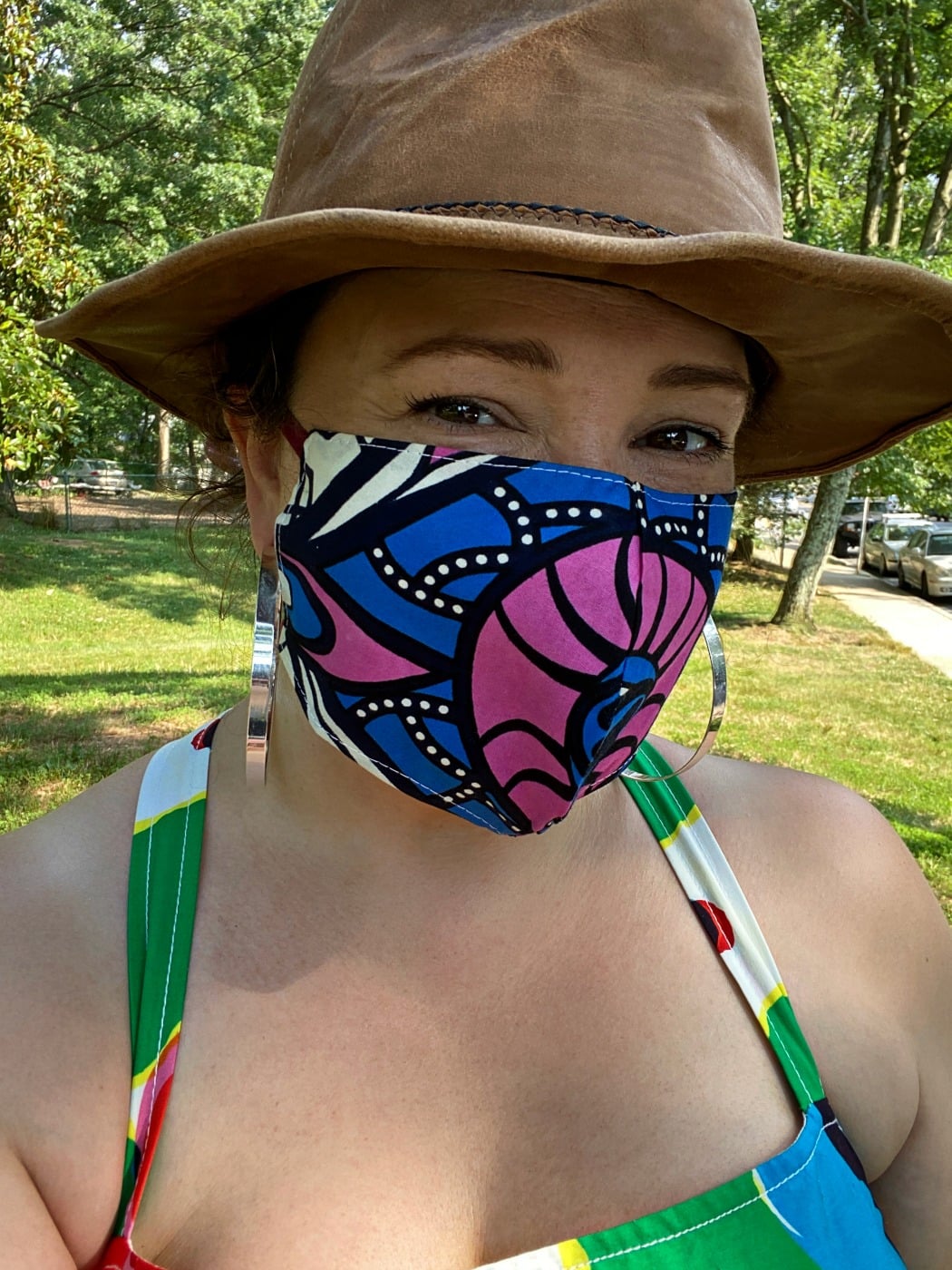 woman wearing a blue and hot pink printed cloth face mask from Kaela Kay