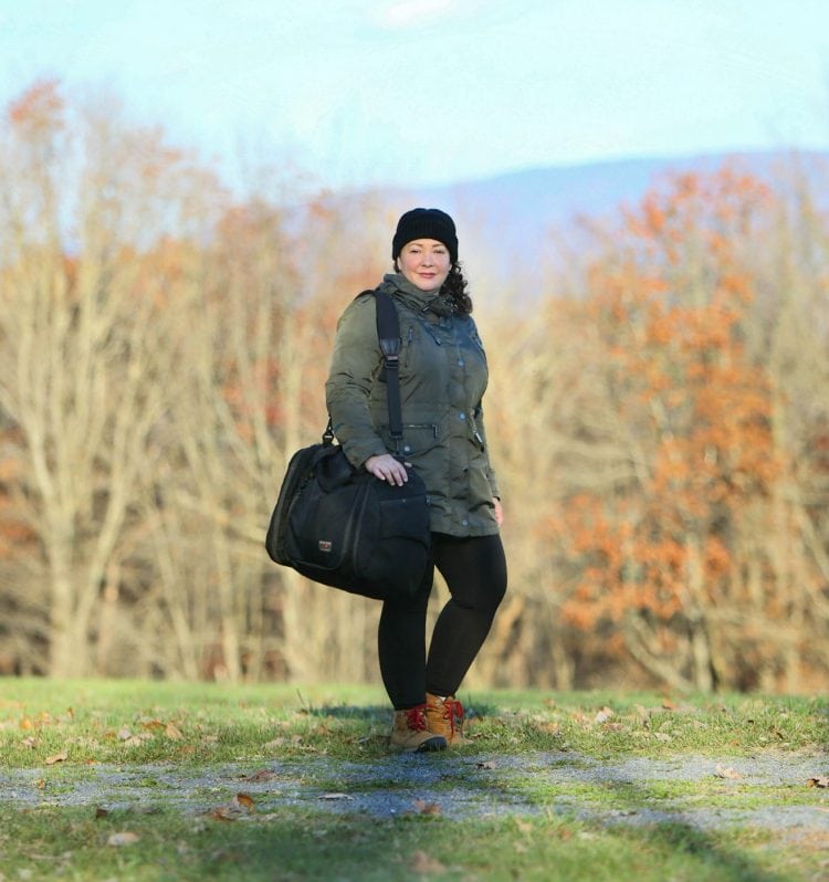 Alison Gary of Wardrobe Oxygen, an over 40 woman just 5'3" shows how the Tom Bihn Aeronaut 45 fits over her shoulder.