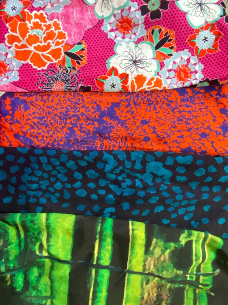 closeup of vividly printed garments from The Kit NYC