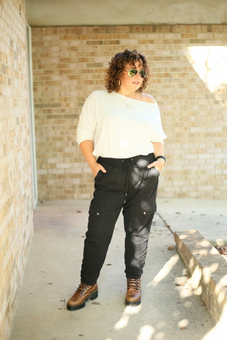 Alison of Wardrobe Oxygen in a white ALLSAINTS off the shoulder long sleeved tee with black cargo pants from Banana Republic