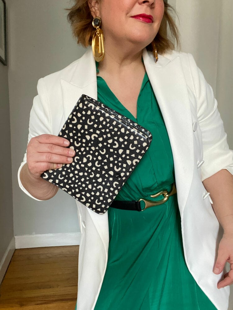 Alison Gary of Wardrobe Oxygen wearing a green Ever by X dress styled with a gold and leather belt and a relaxed white blazer