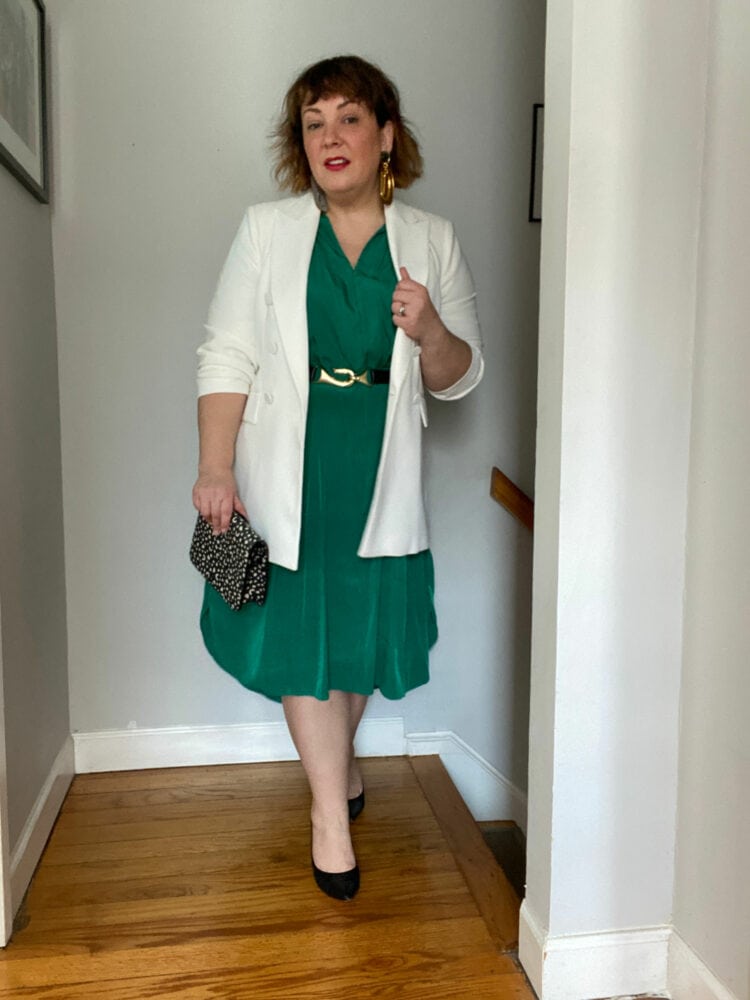 Alison Gary of Wardrobe Oxygen wearing a green Ever by X dress styled with a gold and leather belt and a relaxed white blazer