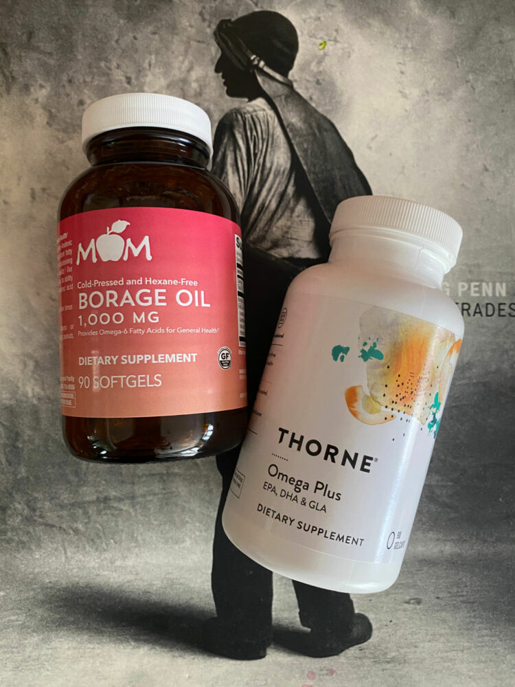 A photo of a bottle of borage oil and a bottle of Thorne Omega Plus supplements