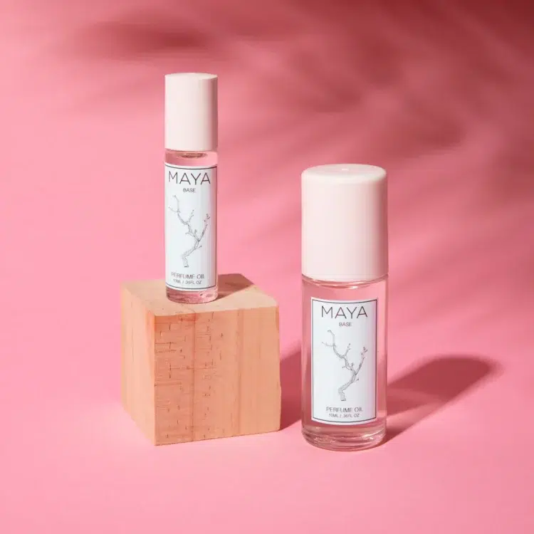 Photo showing two bottles of the roll on fragrance Maya Base