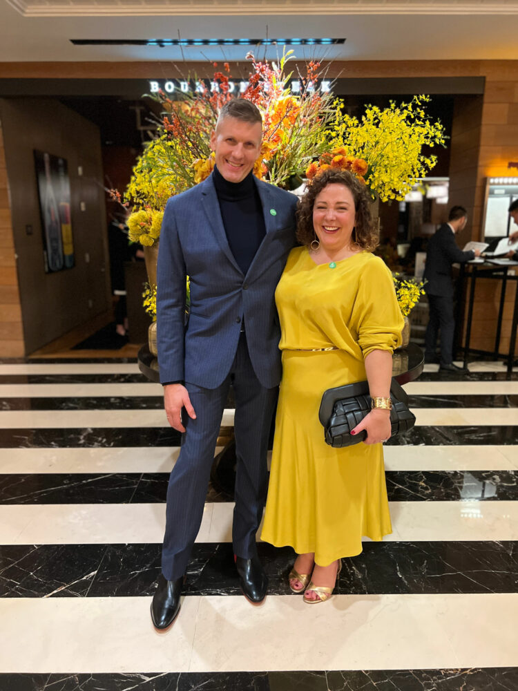 Karl and Alison Gary at the Four Seasons Georgetown for Georgetown Wine & Dine Weekend. Alison is wearing a mustard colored blouse and skirt from M.M.LaFleur