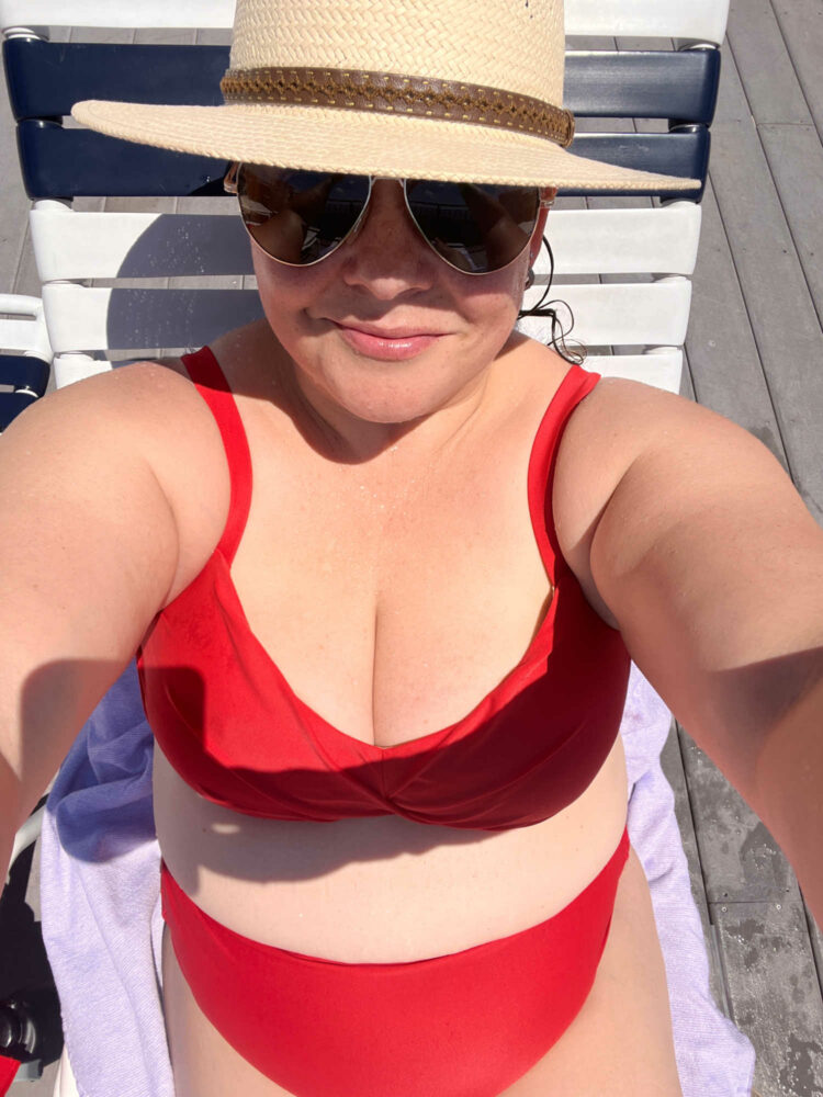 alison of wardrobe oxygen in a red universal standard bikini