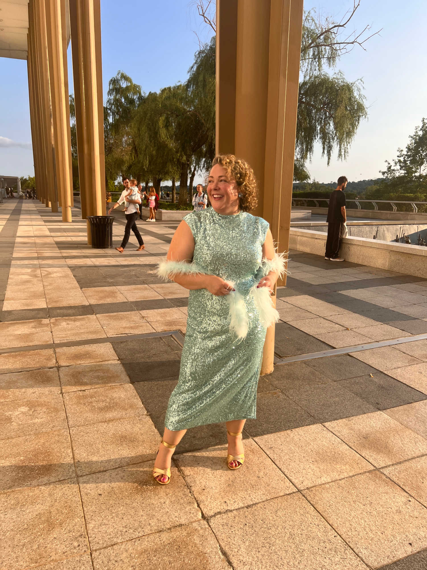 Alison Gary of Wardrobe Oxygen wearing an aquamarine sequined cocktail dress from Ann Taylor at the Kennedy Center in Washington DC.