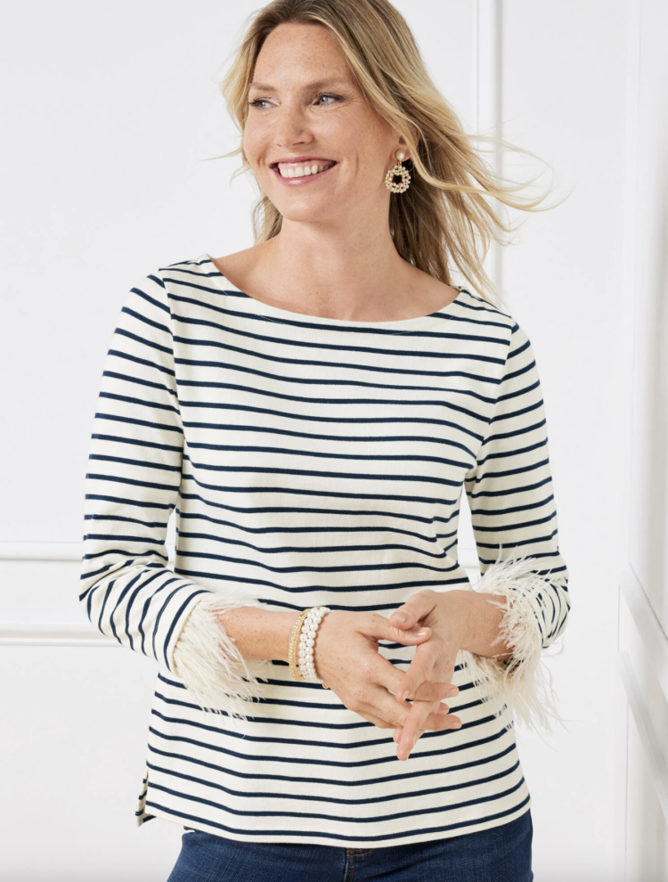 Image from the Talbots website of a blonde woman wearing the Talbots Feather Cuff Bateau Neck Tee