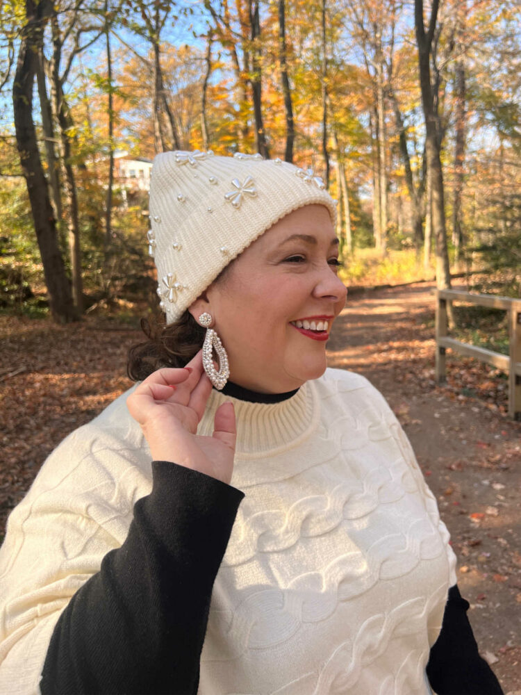 Alison of Wardrobe Oxygen showcasing white beaded earrings from tjmaxx.com