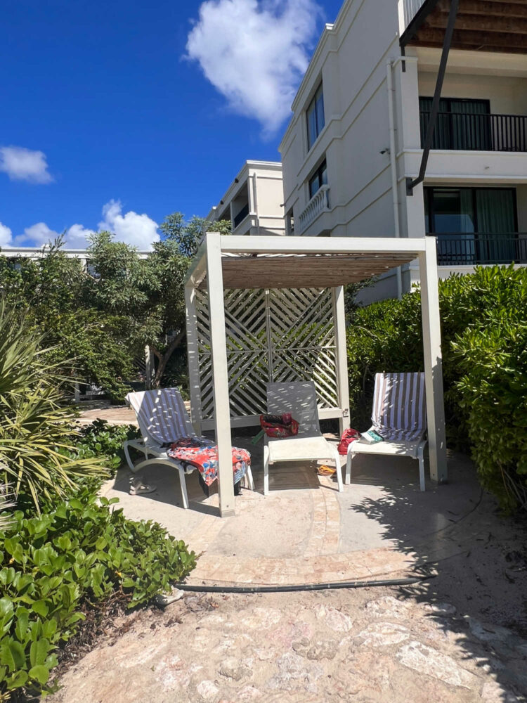 a cabana surrounded by greenery next to the Curacao Marriott Beach Resort