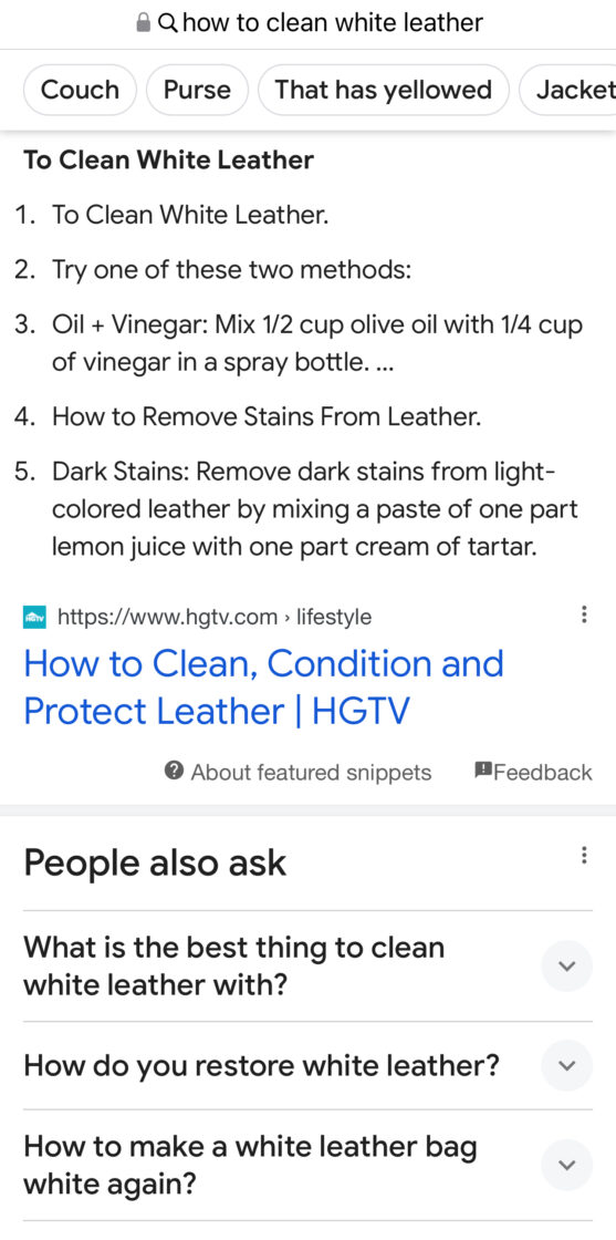 A screenshot of Google when searching for how to clean white leather. After scrolling from the AI, the user finds a list of tips from HGTC and then a section of other questions people also ask.