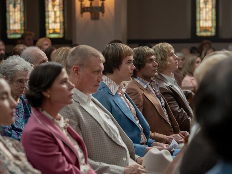 the Von Erich family in a church pew in the movie The Iron Claw