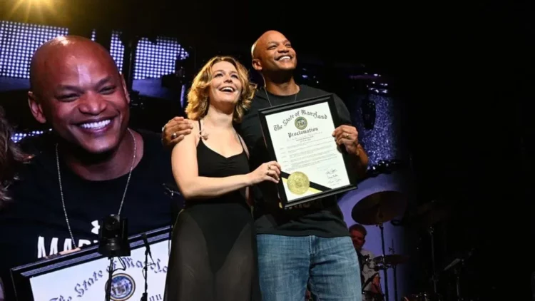 Maryland governor Wes Moore and Maggie Rogers on stage at Merriweather Post Pavilion the day he announced Maggie Rogers Day