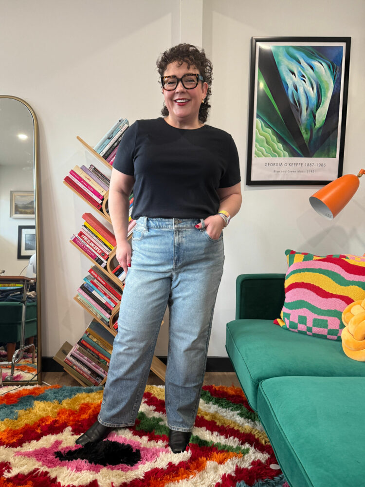 Alison Gary in a black t-shirt tucked into the Talbots High Waist Relaxed Jeans - Allenby Wash