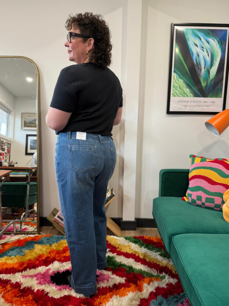 Alison Gary in a black t-shirt tucked into the Talbots Classic Jean Trousers - Renwick Wash