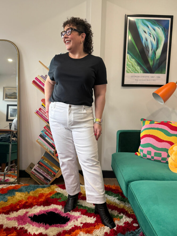 Alison in white mid rise stovepipe jeans from Talbots styled with a black t-shirt and black leather ankle boots.