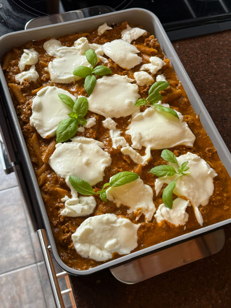 organic lasagne in a blue rectangular bake pan from caraway home