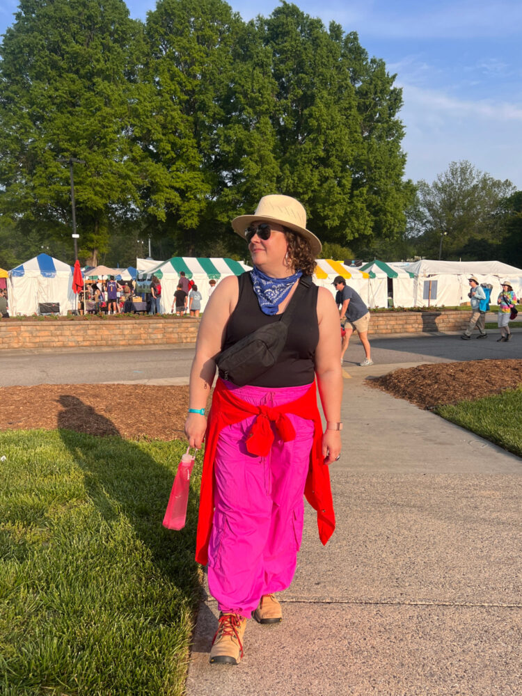black tank and pink parachute pants Woman in a black tank and pink parachute pants at the Merlefest music festival in North Carolina
